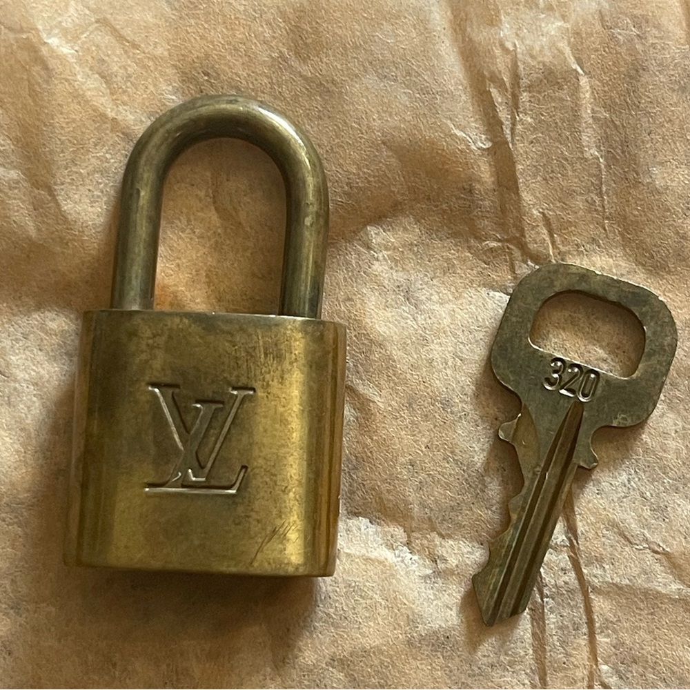 LOUIS VUITTON PADLOCK and 1 KEY GOLD BAG CHARMS